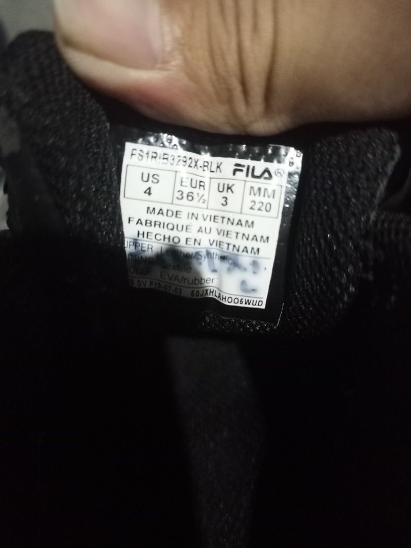 Fila Black Sneakers Size US 4 (Category: Sneakers) located in Mabalacat. Submitted by hasashoe (Listing ID 1470821502, Image 3). Description: - Brand: Fila - Model: FS1RIB3292X-BLK - Color: Black with chunky white soles - Size: US 4 / EUR 36.5 / UK 3 - Materials: Leather and synthetic upper, textile lining, EVA rubber sole - Origin: Made in Vietnam - Condition: Excellent, clean soles and treads with minimal wear on bottom grips.