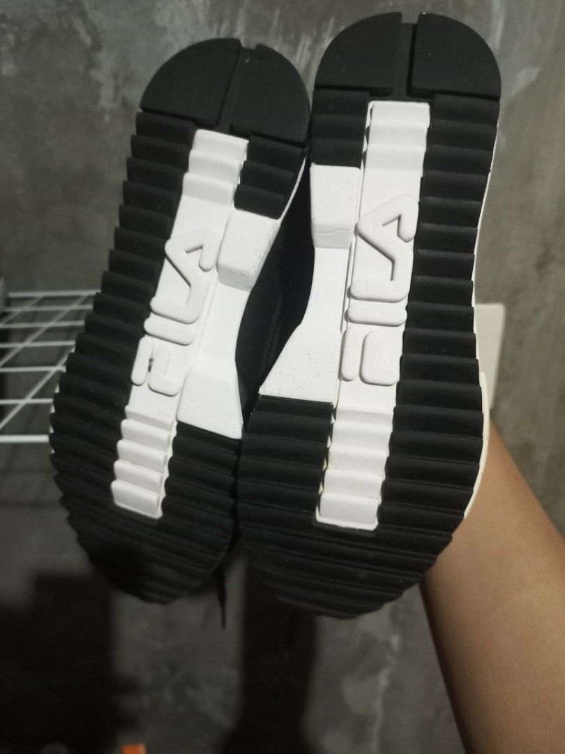 Fila Black Sneakers Size US 4 (Category: Sneakers) located in Mabalacat. Submitted by hasashoe (Listing ID 1470821502, Image 2). Description: - Brand: Fila - Model: FS1RIB3292X-BLK - Color: Black with chunky white soles - Size: US 4 / EUR 36.5 / UK 3 - Materials: Leather and synthetic upper, textile lining, EVA rubber sole - Origin: Made in Vietnam - Condition: Excellent, clean soles and treads with minimal wear on bottom grips.