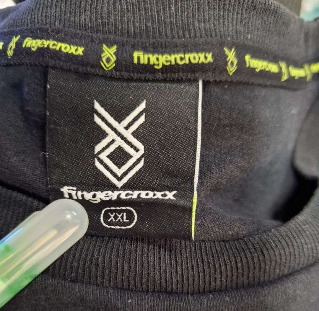fingercroxx Black Graphic Tee XXL (Category: Tshirts & Polo Shirts ) located in Manila. Submitted by jazil.ladyliz (Listing ID 1470769124, Image 3). Description: - Brand: Fingercroxx - Size: XXL - Material: 100% Cotton - Design: Large graphic print with logo lettering and character design on front, plain black back - Fit: Crew neckline with inner brand taping and short sleeves - Care: Hand wash cold recommended.