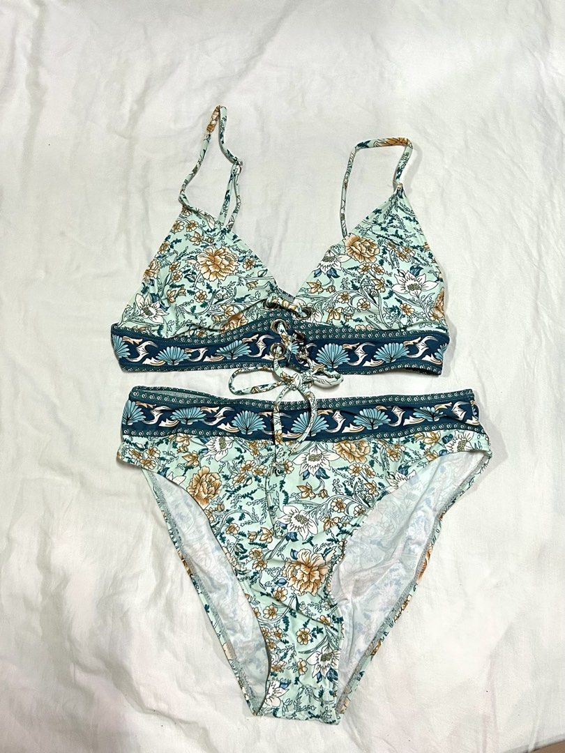Floral Print Two-Piece Bikini Set (Category: Bikinis & Swimsuits) located in Muntinlupa City. Submitted by _gudstuff (Listing ID 1470889441, Image 1). Description: - Top: Adjustable shoulder straps, lace-up front detail with metal rings - Bottoms: High-waisted fit with matching decorative waist tie - Condition: Good as new, worn once.