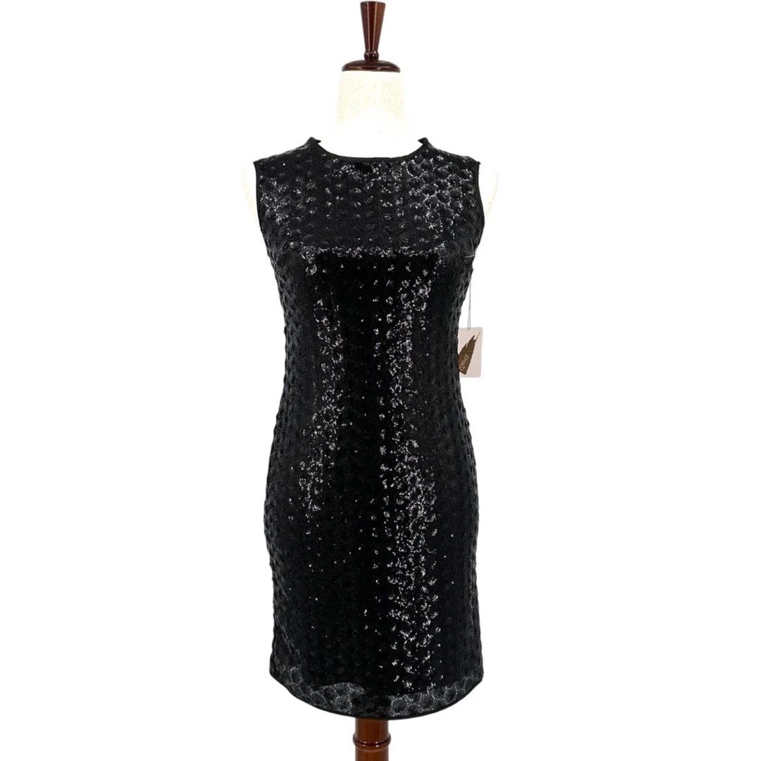 Forever 21 Black Sequin Dress Size L (Category: Dresses) located in Manila. Submitted by tineshoppe (Listing ID 1470888573, Image 1). Description: - Brand: Forever 21 - Size: L - Color: Black with all-over light-catching sequins - Design: Sleeveless, round neckline, and full-length gold back zipper - Comfort: Fully lined interior - Material: Nylon/polyamide shell with polyester/spandex lining - Never worn, na remove lang yung tag because I washed
