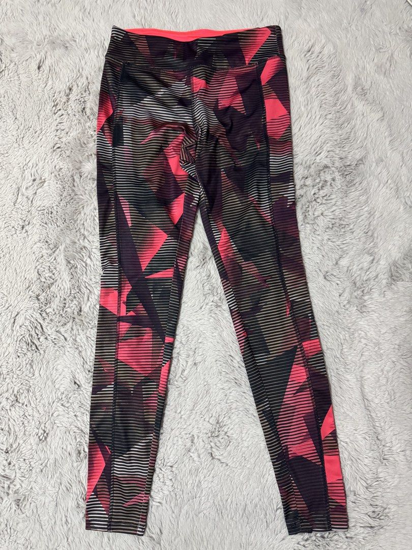 Forever 21 Geometric Print Active Leggings Size S (Category: Activewear) located in Calamba. Submitted by cheriiv (Listing ID 1470749085, Image 1). Description: - Brand: Forever 21 - Size: Small - Design: Bright pink, black, and grey geometric graphic pattern - Details: Neon pink inner waistband with a convenient hidden pocket - Fit: Full-length workout tights with a supportive stretch - Care: Machine washable synthetic material.