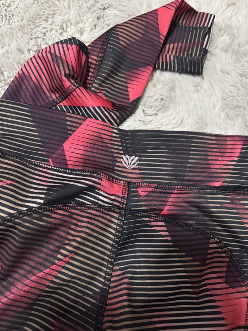 Forever 21 Geometric Print Active Leggings Size S (Category: Activewear) located in Calamba. Submitted by cheriiv (Listing ID 1470749085, Image 3). Description: - Brand: Forever 21 - Size: Small - Design: Bright pink, black, and grey geometric graphic pattern - Details: Neon pink inner waistband with a convenient hidden pocket - Fit: Full-length workout tights with a supportive stretch - Care: Machine washable synthetic material.