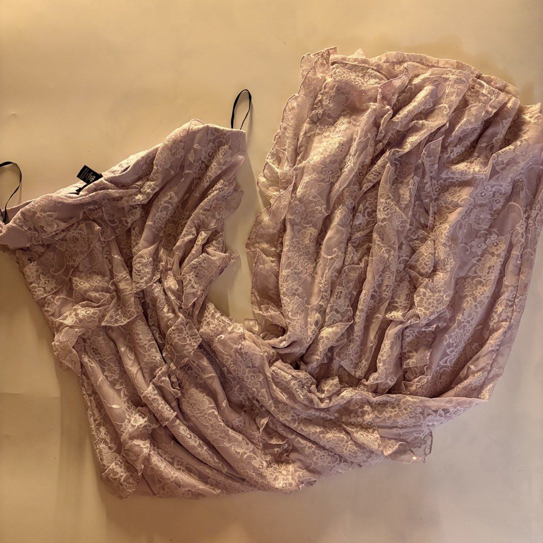 Forever 21+ Plus Size lilac Lace Dress (Category: Dresses) located in Quezon City. Submitted by tomatoes221 (Listing ID 1470770170, Image 1). Description: - Brand: Forever 21+ - Size: 0X - Color: Light pink with delicate black straps - Design: All-over lace pattern with ruffles throughout - Lining: Soft fabric lining underneath - Condition: Great piece, perfect for casual or dressed-up wear.