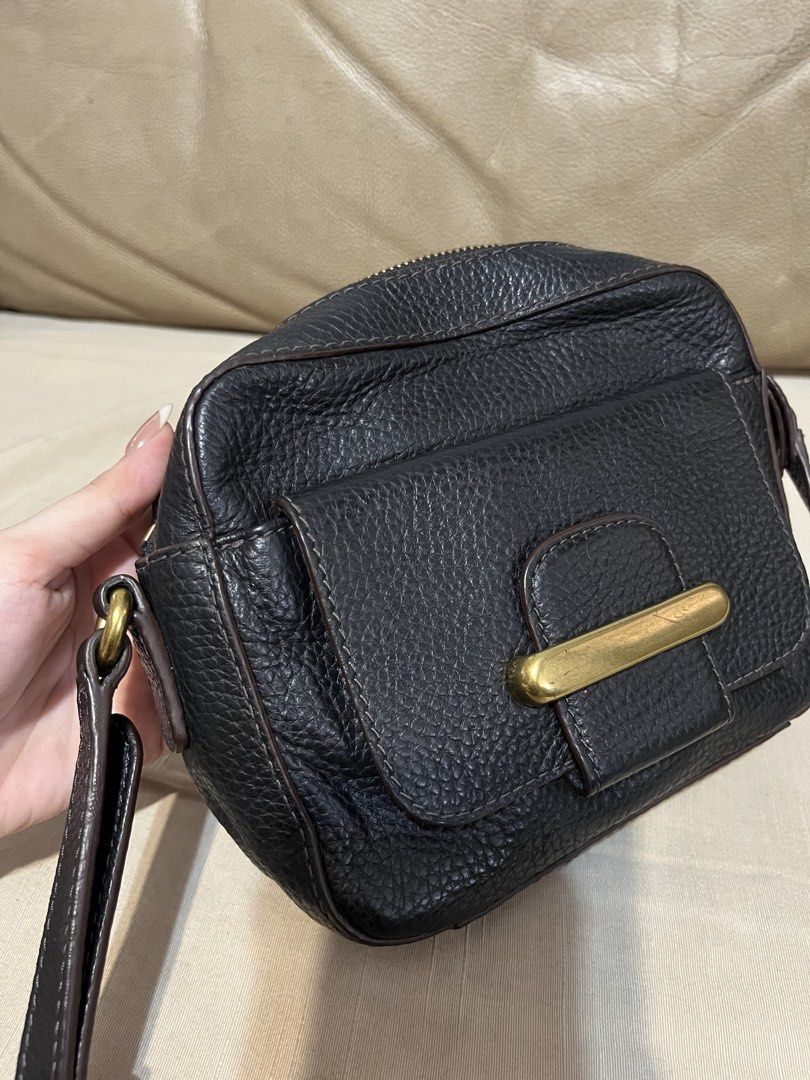 Fossil Black Leather Crossbody Bag (Category: Cross-body Bags) located in Calamba. Submitted by jupreloved_ (Listing ID 1470792628, Image 3). Description: Features a front flap pocket with gold hardware, secure top zip closure, and an adjustable dark brown strap. Brand: Fossil Size: Small Shipping through J&T. Payment are strictly through GCASH only, no COD. Exact size and color may be different from the picture. This is a preloved item, please m