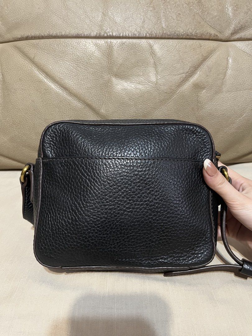 Fossil Black Leather Crossbody Bag (Category: Cross-body Bags) located in Calamba. Submitted by jupreloved_ (Listing ID 1470792628, Image 2). Description: Features a front flap pocket with gold hardware, secure top zip closure, and an adjustable dark brown strap. Brand: Fossil Size: Small Shipping through J&T. Payment are strictly through GCASH only, no COD. Exact size and color may be different from the picture. This is a preloved item, please m
