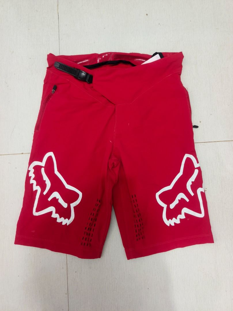 Fox Racing Mountain Biking Shorts Red Size 32 (Category: Shorts) located in Antipolo. Submitted by rekreek (Listing ID 1470871289, Image 1). Description: - Brand: Red Fox Racing MTB Shorts - Size: 32 - Design: Large white Fox head logos on both legs - Closure: Secure ratchet waist system - Pockets: Convenient zipped side pockets - Ventilation: Perforated holes on front and back for maximum airflow - Material: 71% polyester, 17% polyamide nylon, 7