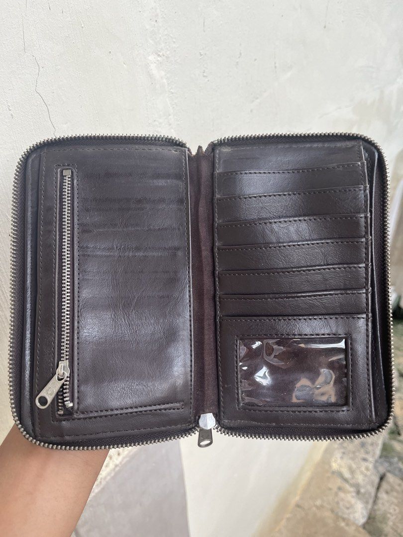 Fred Perry Leopard Print Zip Around Wallet (Category: Wallets & Card holders) located in Kidapawan. Submitted by azythrift (Listing ID 1470819502, Image 3). Description: - Brand: Fred Perry - Condition: Brand new with tags attached, super clean inside and out - Pattern/Design: Bold leopard print with signature silver-tone laurel wreath emblem - Interior: Brown lining with multiple card slots, ID window, and a secure zippered coin compartment - Cl