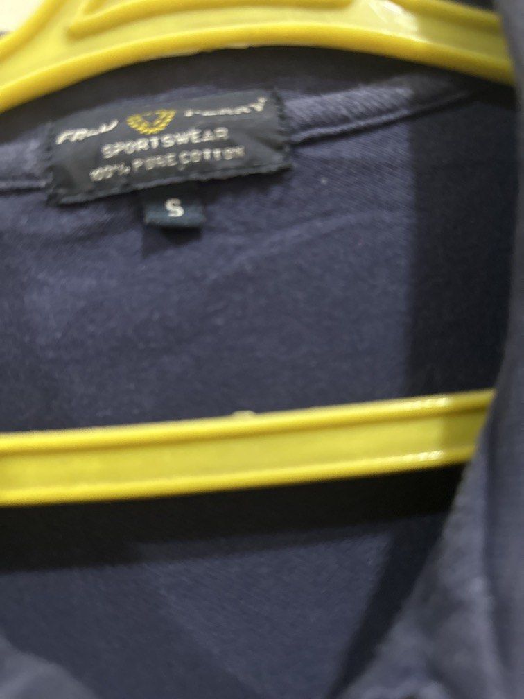 Fred Perry Small dark blue with red striped collar (Category: Tshirts & Polo Shirts ) located in Lipa City. Submitted by jnlxv87 (Listing ID 1470847907, Image 2). Description: Small on tag Width 41cm Length 63cm.