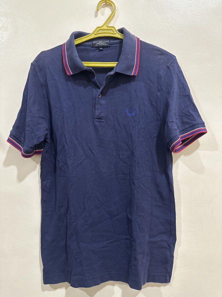 Fred Perry Small dark blue with red striped collar (Category: Tshirts & Polo Shirts ) located in Lipa City. Submitted by jnlxv87 (Listing ID 1470847907, Image 1). Description: Small on tag Width 41cm Length 63cm.