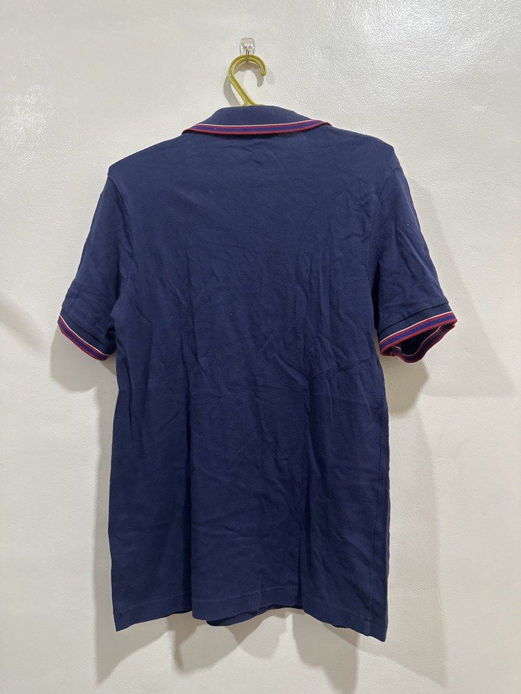 Fred Perry Small dark blue with red striped collar (Category: Tshirts & Polo Shirts ) located in Lipa City. Submitted by jnlxv87 (Listing ID 1470847907, Image 3). Description: Small on tag Width 41cm Length 63cm.
