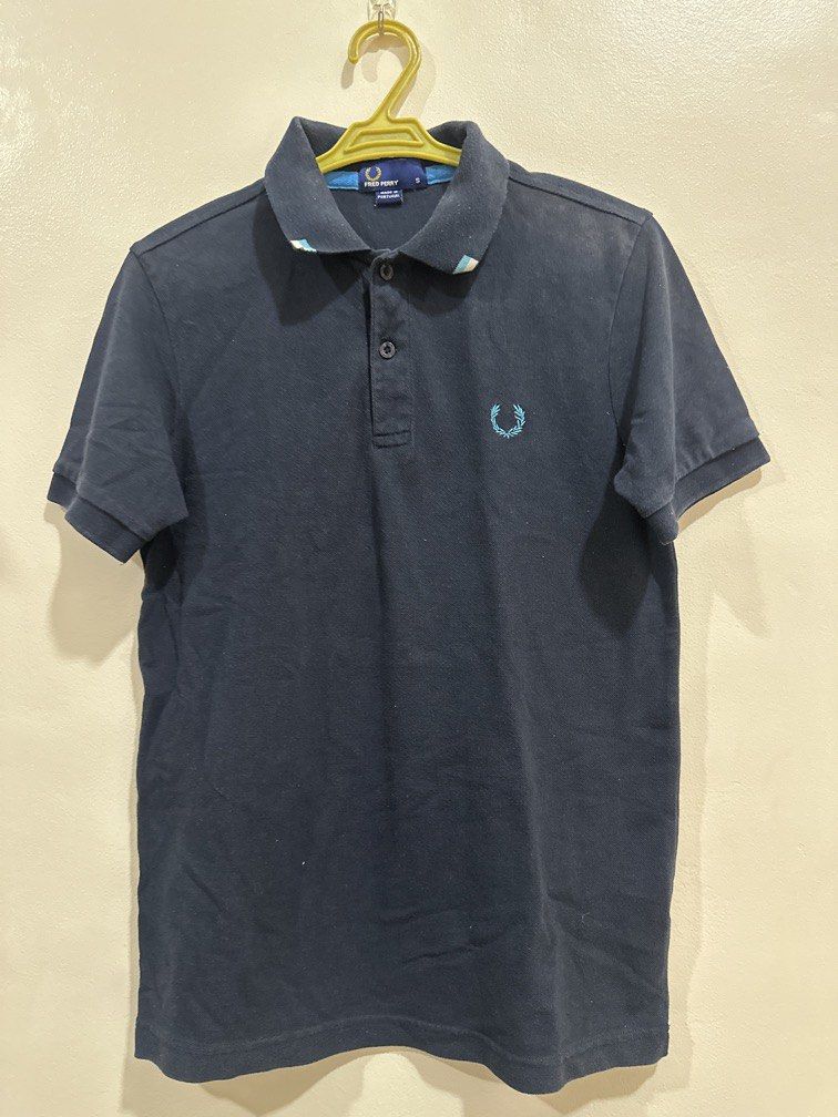 Fred Perry small navy blue polo shirt (Category: Tshirts & Polo Shirts ) located in Lipa City. Submitted by jnlxv87 (Listing ID 1470847153, Image 2). Description: Small on tag Shoulders39cm Width 44cm Length 62cm.