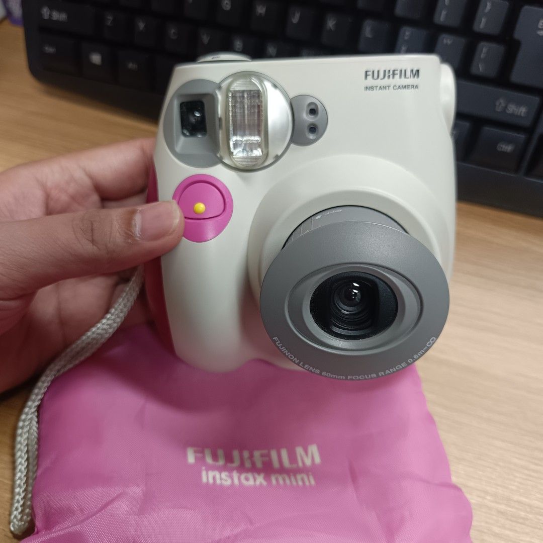 Fujifilm Instax Mini 7s Camera with Pink Pouch (Category: Cameras) located in Pasig City. Submitted by jeffzyyyyy (Listing ID 1470766131, Image 1). Description: Working! Slightly used No flaws Fresh Battery slot See sample photos Free Battery.