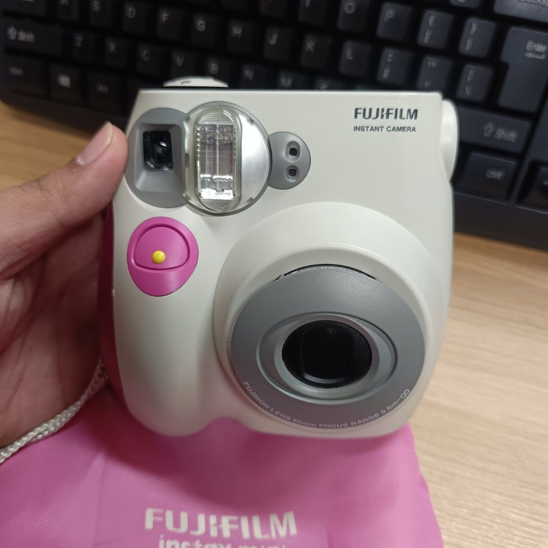 Fujifilm Instax Mini 7s Camera with Pink Pouch (Category: Cameras) located in Pasig City. Submitted by jeffzyyyyy (Listing ID 1470766131, Image 2). Description: Working! Slightly used No flaws Fresh Battery slot See sample photos Free Battery.