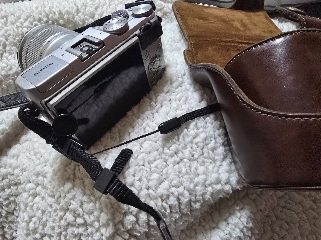 Fujifilm X-A3 (Category: Cameras) located in Cavite. Submitted by maknaelala6 (Listing ID 1470878665, Image 3). Description: - Model: Fujifilm X-A3 Mirrorless Camera Body (Silver/Brown) - Lens: Fujinon XC 16-50mm f/3.5-5.6 OIS II (clean glass) - Condition: Fully functional, flip-up screen works perfectly - Extras: Matching brown leather half case and black neck strap included - Ideal for: Beginners looking for a stylish and reliable interchangeab