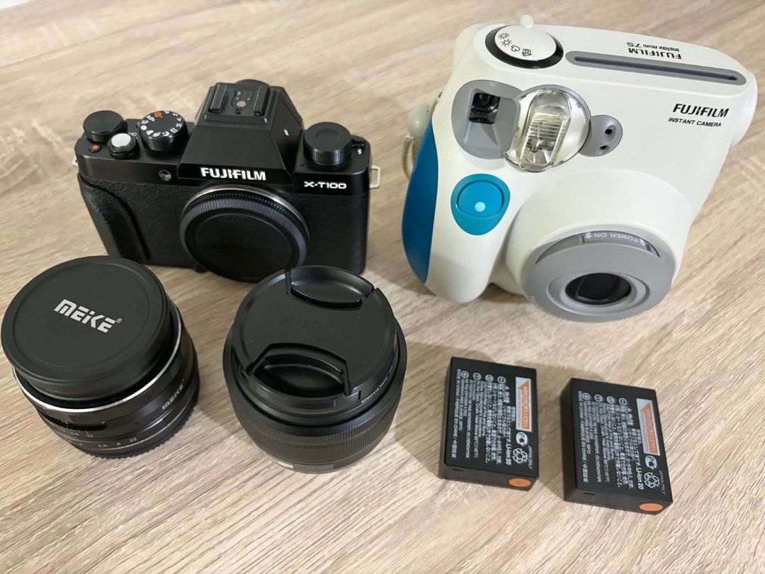 Fujifilm X-T100 Mirrorless Camera and Instax Mini 7S Bundle (Category: Cameras) located in Manila. Submitted by nintendoswitchgames_ (Listing ID 1470769828, Image 2). Description: - Fujifilm X-T100 mirrorless camera body (Black) - Fujifilm Instax Mini 7S instant camera (White & Blue) - Two lenses with caps (one Meike 50mm lens and Kit lens included) - Two extra rechargeable camera batteries - Everything pictured is included in the bundle - Clean 