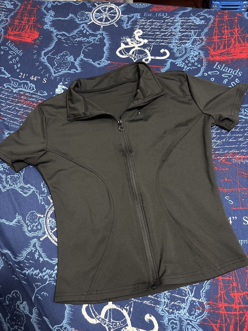 Fuyogi Black short-sleeve athletic zip-up top (Category: Activewear) located in Quezon City. Submitted by iya_handovers (Listing ID 1470834901, Image 1). Description: Used 1x Wrong size ordered. Perfect for yoga, pickleball, running, gym..