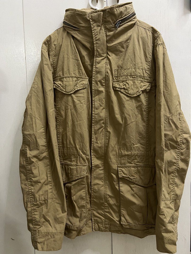 GAP | Khaki Utility Jacket (L) (Category: Coats, Jackets and Outerwear) located in Valenzuela. Submitted by urdeclutteringtita (Listing ID 1470744954, Image 1). Description: - Brand: GAP - Size: Large - Color: Khaki - Closure: Zip-up - Features: Multiple front pockets and a packable hood that zips into the collar - Fabric: Sturdy construction, perfect for layering during cooler weather RFS: Decluttering Payment method: Full payment prior shipping