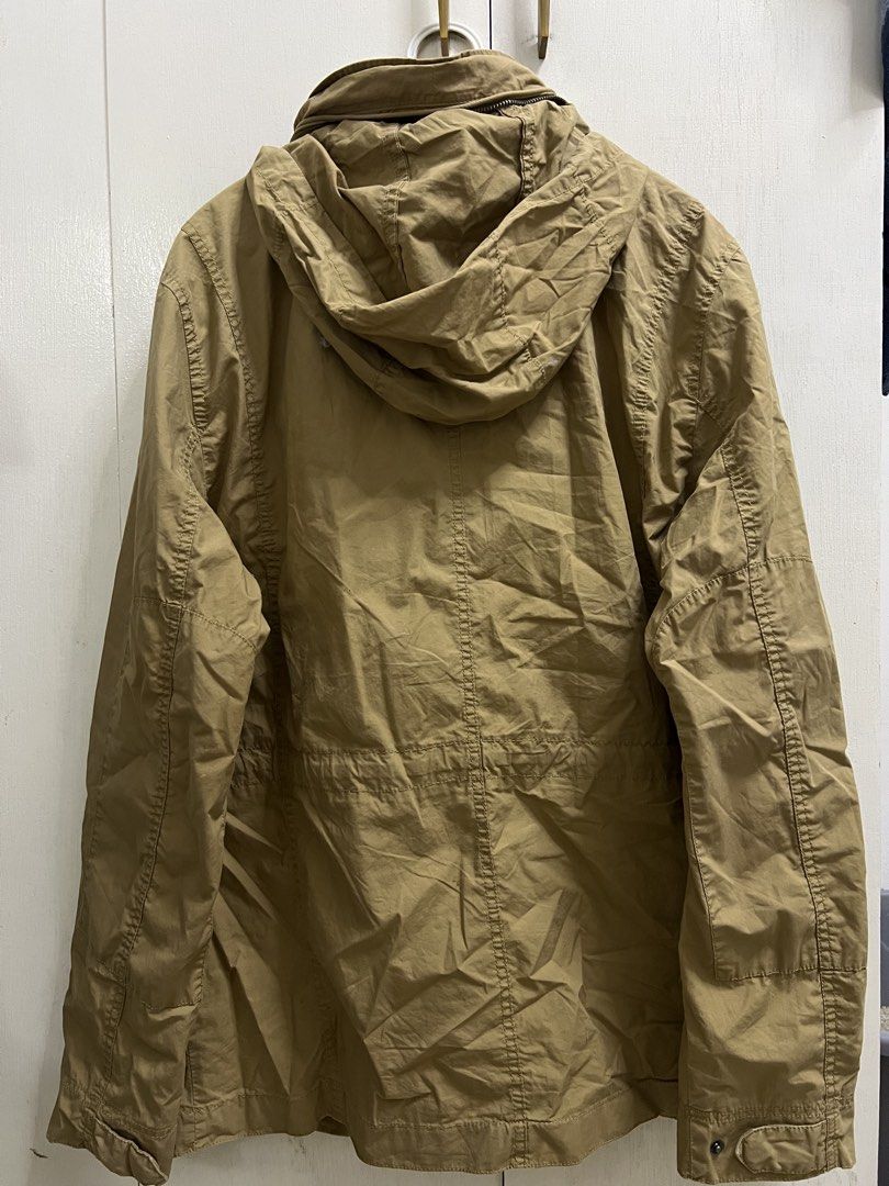 GAP | Khaki Utility Jacket (L) (Category: Coats, Jackets and Outerwear) located in Valenzuela. Submitted by urdeclutteringtita (Listing ID 1470744954, Image 2). Description: - Brand: GAP - Size: Large - Color: Khaki - Closure: Zip-up - Features: Multiple front pockets and a packable hood that zips into the collar - Fabric: Sturdy construction, perfect for layering during cooler weather RFS: Decluttering Payment method: Full payment prior shipping