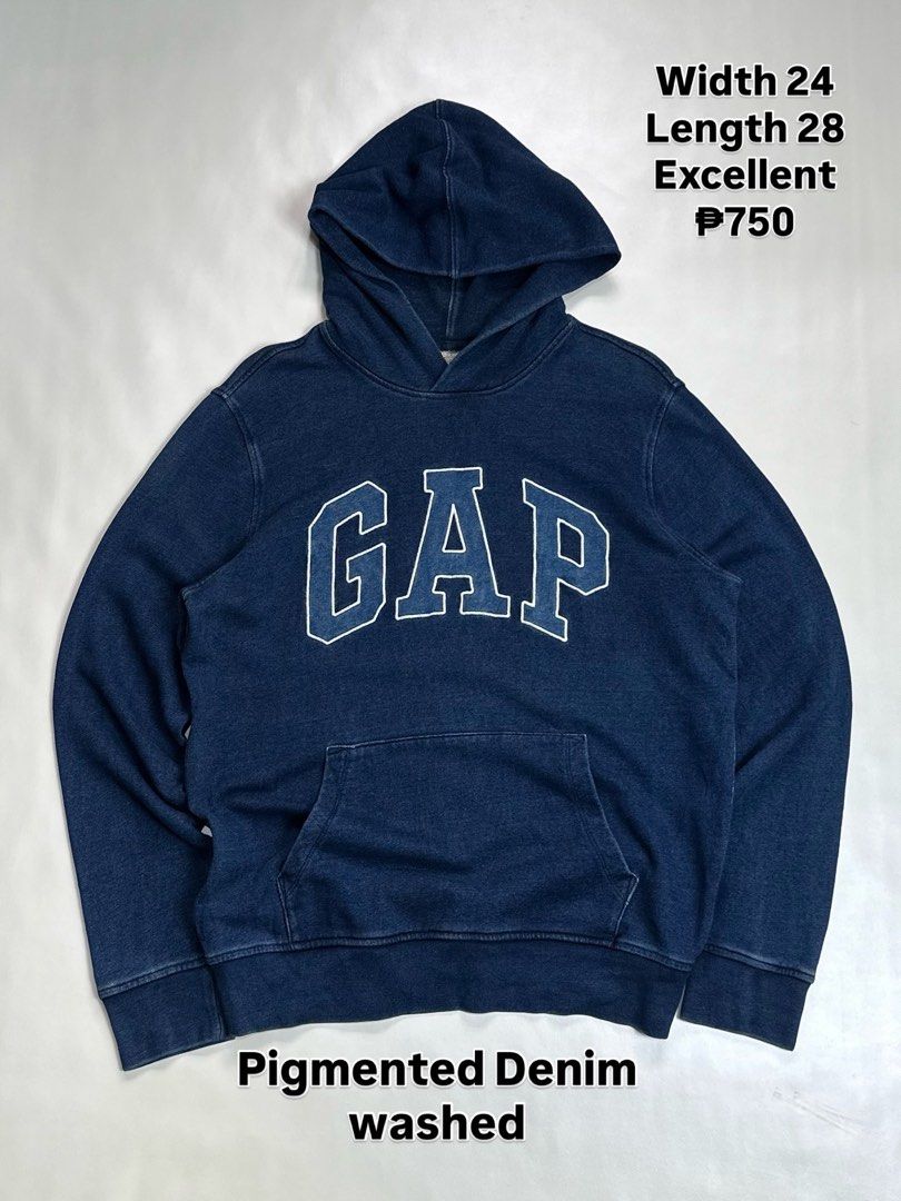 GAP Pigmented Denim Washed Hoodie Size M (Category: Coats, Jackets and Outerwear) located in Daet. Submitted by thrifthings2018 (Listing ID 1470845554, Image 1). Description: - Brand: GAP - Style: Pigmented denim washed hoodie - Color: Classic navy blue with large white chest logo - Size: Medium (Width: 24", Length: 28") - Details: Front kangaroo pocket, lined hood, ribbed cuffs and hem - Origin: Made in Vietnam - Condition: Excellent vintage loo