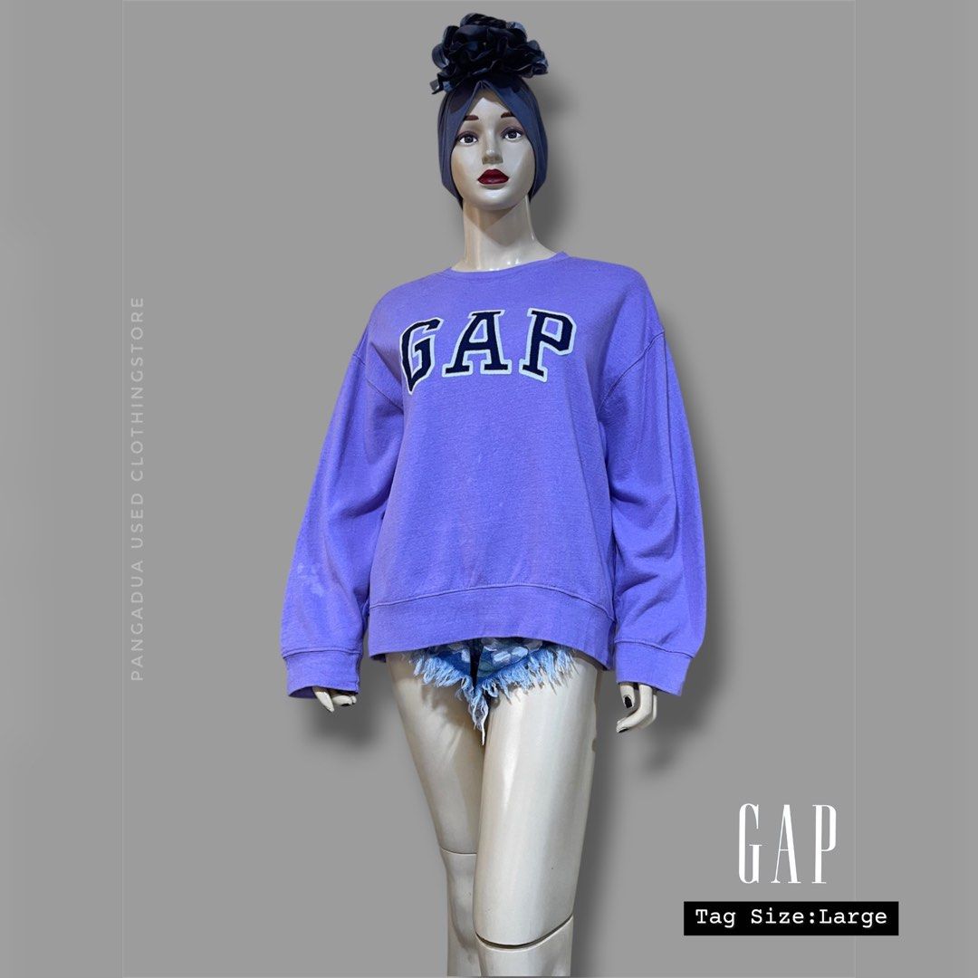 GAP Purple Sweatshirt Size Large (Category: Coats, Jackets and Outerwear) located in Naga. Submitted by 2ndusedclothingstore (Listing ID 1470854521, Image 1). Description: - Brand: GAP - Color: Purple - Size: Large (Relaxed fit with dropped shoulders) - Design: Classic crewneck with large logo lettering across the chest - Comfort: Soft fleece interior, ribbed cuffs, and hem to keep you warm - Origin: Made in India - Condition: Great everyday casu