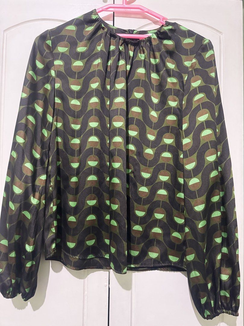 Geometric Print Long Sleeve Blouse Black Green (Category: Longsleeves) located in Manila. Submitted by melissaal82890 (Listing ID 1470893372, Image 2). Description: ZARA Made in Morocco Design: Green and black geometric pattern - Sleeves: Long bishop sleeves with elastic cuffs - Neckline: Crew neck with slight gathering detail - Closure: Convenient back zipper - Material: Silky smooth finish - Versatility: Ideal for both office wear and casual ou