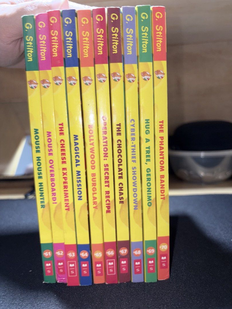 Geronimo Stilton Books Bundle Set 61-70 10 Books (Category: Children's Books) located in Mandaluyong City. Submitted by juliansthings (Listing ID 1470909276, Image 3). Description: - Set of 10 Geronimo Stilton books (Books 61-70) - Titles: Mouse House Hunter, Mouse Overboard, The Cheese Experiment, Magical Mission, Bollywood Burglary, Operation Secret Recipe, The Chocolate Chase, Cyber-Thief Showdown, Hug a Tree Geronimo, and The Phantom Bandit -