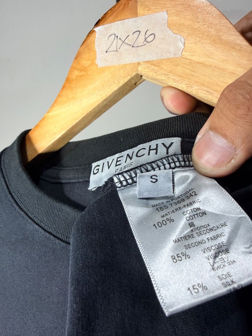 Givenchy Black Graphic Tee (Category: Activewear) located in Caloocan City. Submitted by choidelfin.420 (Listing ID 1470825997, Image 3). Description: - Brand: Givenchy - Color: Black - Style: Classic fit, crew neck, short sleeves - Design: Large distressed 4G logo on chest with white brand lettering - Detail: Small white logo patch on the lower back hem - Condition: Good casual wear option - Size: Large.