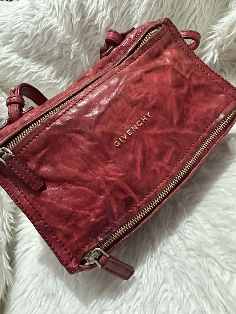 Givenchy Mini Pandora Sugar Crossbody Bag Red (Category: Cross-body Bags) located in Lemery. Submitted by venus23 (Listing ID 1470760108, Image 2). Description: - Brand: Givenchy - Style: Mini Pandora Crossbody Bag - Color: Vibrant Red with Gold-tone Hardware - Material: Genuine Leather with Beige Fabric Interior - Features: Top and front zip closure, adjustable crossbody strap, stamped front logo - Origin: Made in Italy - Condition: Compact boxy