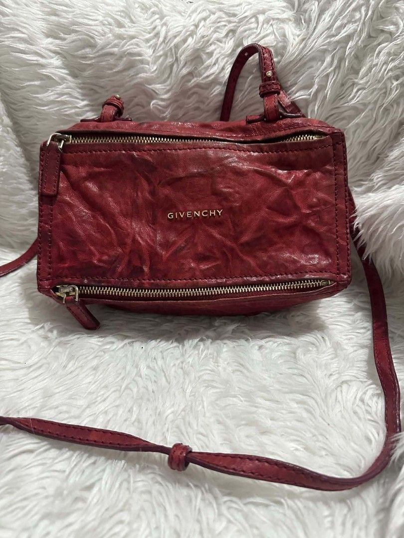 Givenchy Mini Pandora Sugar Crossbody Bag Red (Category: Cross-body Bags) located in Lemery. Submitted by venus23 (Listing ID 1470760108, Image 1). Description: - Brand: Givenchy - Style: Mini Pandora Crossbody Bag - Color: Vibrant Red with Gold-tone Hardware - Material: Genuine Leather with Beige Fabric Interior - Features: Top and front zip closure, adjustable crossbody strap, stamped front logo - Origin: Made in Italy - Condition: Compact boxy