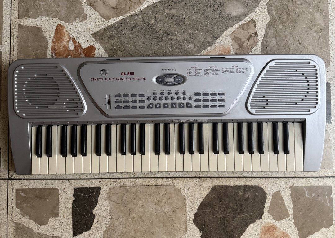 Global GL-555 54 Keys Electronic Keyboard (Category: Musical Instruments) located in Las Pinas. Submitted by emdjss (Listing ID 1470781964, Image 1). Description: - Model: Global GL-555 Portable Electronic Organ - Condition: Tested and fully working (keys and buttons responsive) - Design: Compact silver body with standard keys and built-in dual speakers - Features: Multiple timbre, rhythm, and demo song settings - Power: Runs on batteries or exte