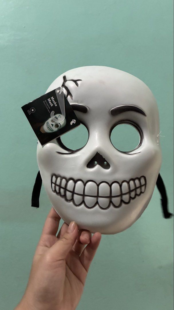 Glow in the dark skull mask (Category: Occasions & Party Supplies) located in Manila. Submitted by dukejah (Listing ID 1470808971, Image 1). Description: - Condition: Brand new with original tag attached - Design: White skull with black cartoon-style eyes and teeth - Special Feature: Glows in the dark - Material: Lightweight plastic - Fit: Secure elastic black strap on both sides.