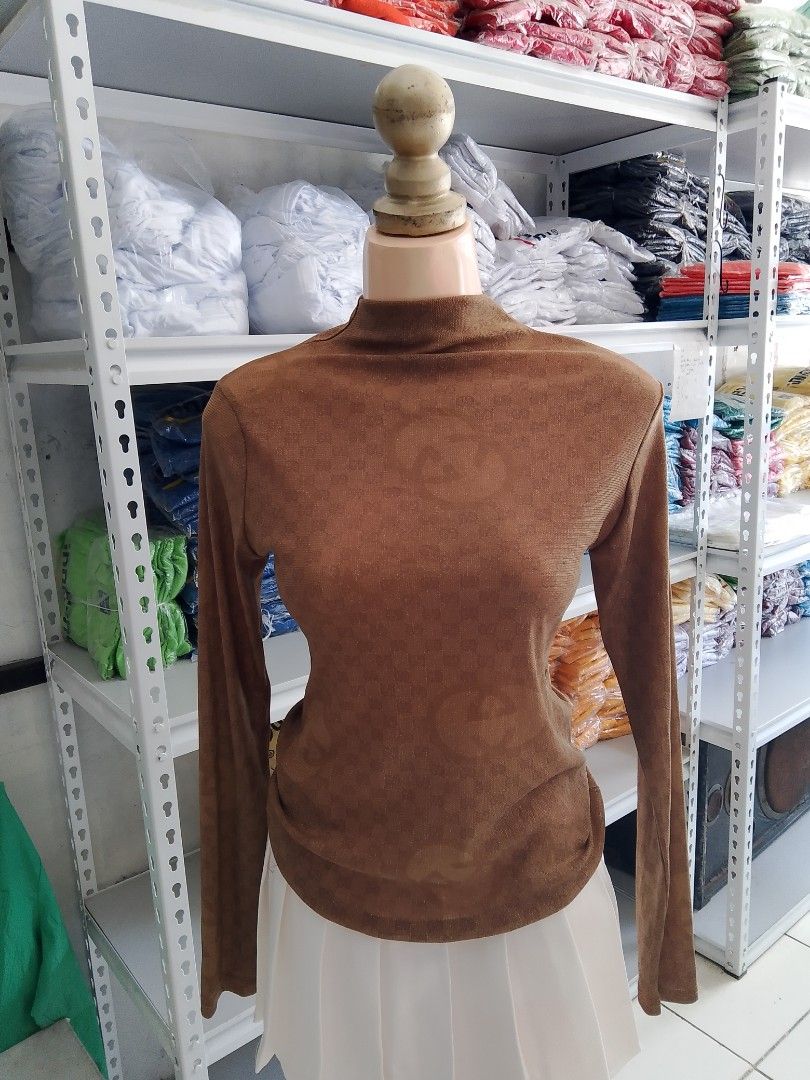 Gold Mesh Monogram Mock Neck Long Sleeve Top (Category: Longsleeves) located in Midsayap. Submitted by jarethshop (Listing ID 1470770350, Image 1). Description: - Color: Gold - Style: Fitted long sleeve with mock neck - Design: Subtle woven monogram pattern - Material: Thin, lightweight, and stretchy fabric - Versatility: Great for easy layering or wearing on its own.