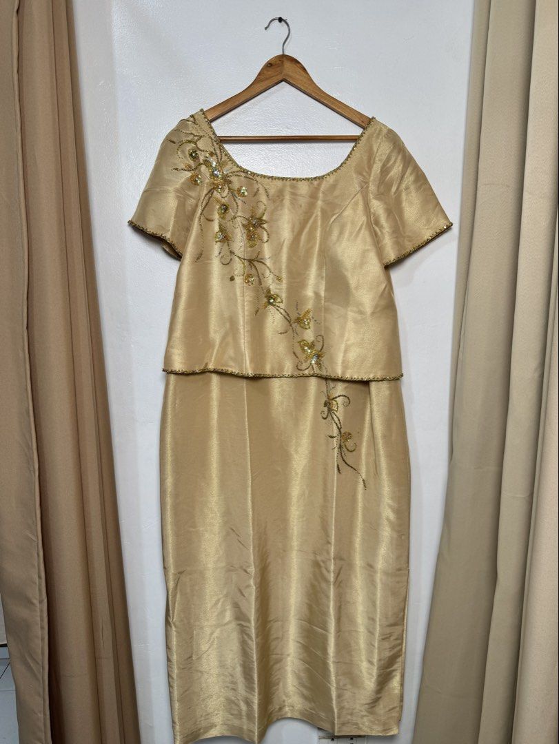 Gold Two-Piece Beaded Formal Gown (Category: Evening dresses & gowns) located in Marikina City. Submitted by shae_preloved (Listing ID 1470918199, Image 2). Description: Mother’s Gown Fits XL-2XL - Color: Gold - Style: Two-piece formal dress with short sleeves and a scoop neckline - Details: Exquisite beaded floral vine pattern cascading from the right shoulder down to the skirt - Length: Straight midi-length skirt - Fabric: Shiny with a smooth t