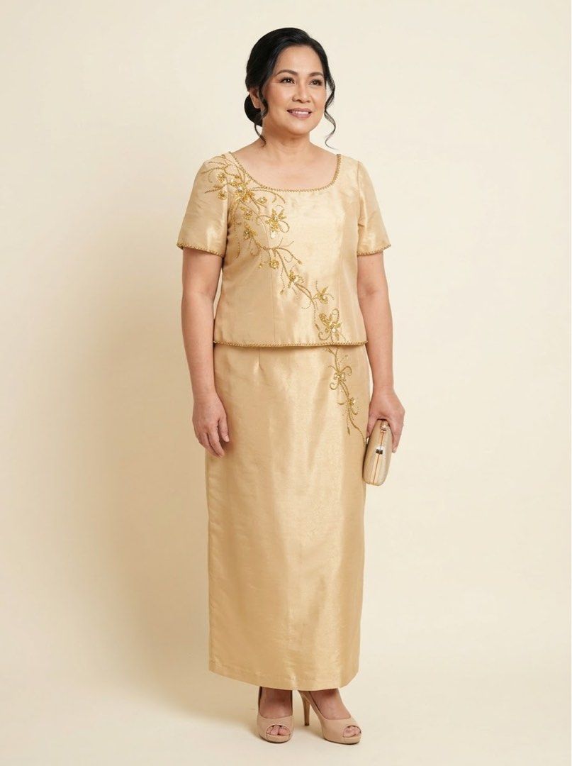 Gold Two-Piece Beaded Formal Gown (Category: Evening dresses & gowns) located in Marikina City. Submitted by shae_preloved (Listing ID 1470918199, Image 1). Description: Mother’s Gown Fits XL-2XL - Color: Gold - Style: Two-piece formal dress with short sleeves and a scoop neckline - Details: Exquisite beaded floral vine pattern cascading from the right shoulder down to the skirt - Length: Straight midi-length skirt - Fabric: Shiny with a smooth t