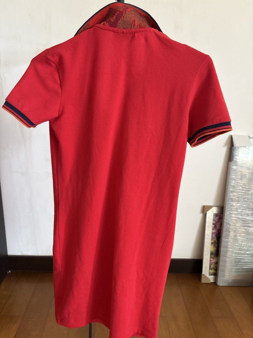 Grab-a-Tee Red Polo Dress Size S (Category: Dresses) located in Manila. Submitted by damburgurt (Listing ID 1470798639, Image 3). Description: - Brand: Grab-A-Tee - Size: Small - Color: Bright red with red, blue, and orange patterned collar - Sleeves: Short sleeves with striped cuffs - Style: Casual slip-on polo dress with open neckline - Condition: Great for warm weather and everyday wear.