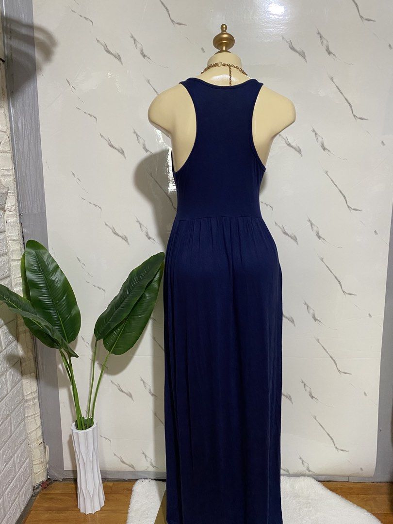 Grecerelle Navy Blue Maxi Dress Size M (Category: Dresses) located in Taguig. Submitted by dinoswear.ph (Listing ID 1470804982, Image 3). Description: - Brand: Grecerelle - Size: Medium (tag attached) - Color: Navy Blue - Style: Sleeveless tank, scoop neckline, gathered waist, floor-length - Material: Soft, stretchy, and comfortable - Condition: Great staple piece - Best For: Casual outings or running errands.