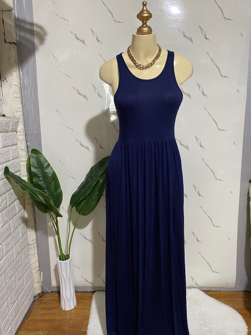 Grecerelle Navy Blue Maxi Dress Size M (Category: Dresses) located in Taguig. Submitted by dinoswear.ph (Listing ID 1470804982, Image 1). Description: - Brand: Grecerelle - Size: Medium (tag attached) - Color: Navy Blue - Style: Sleeveless tank, scoop neckline, gathered waist, floor-length - Material: Soft, stretchy, and comfortable - Condition: Great staple piece - Best For: Casual outings or running errands.