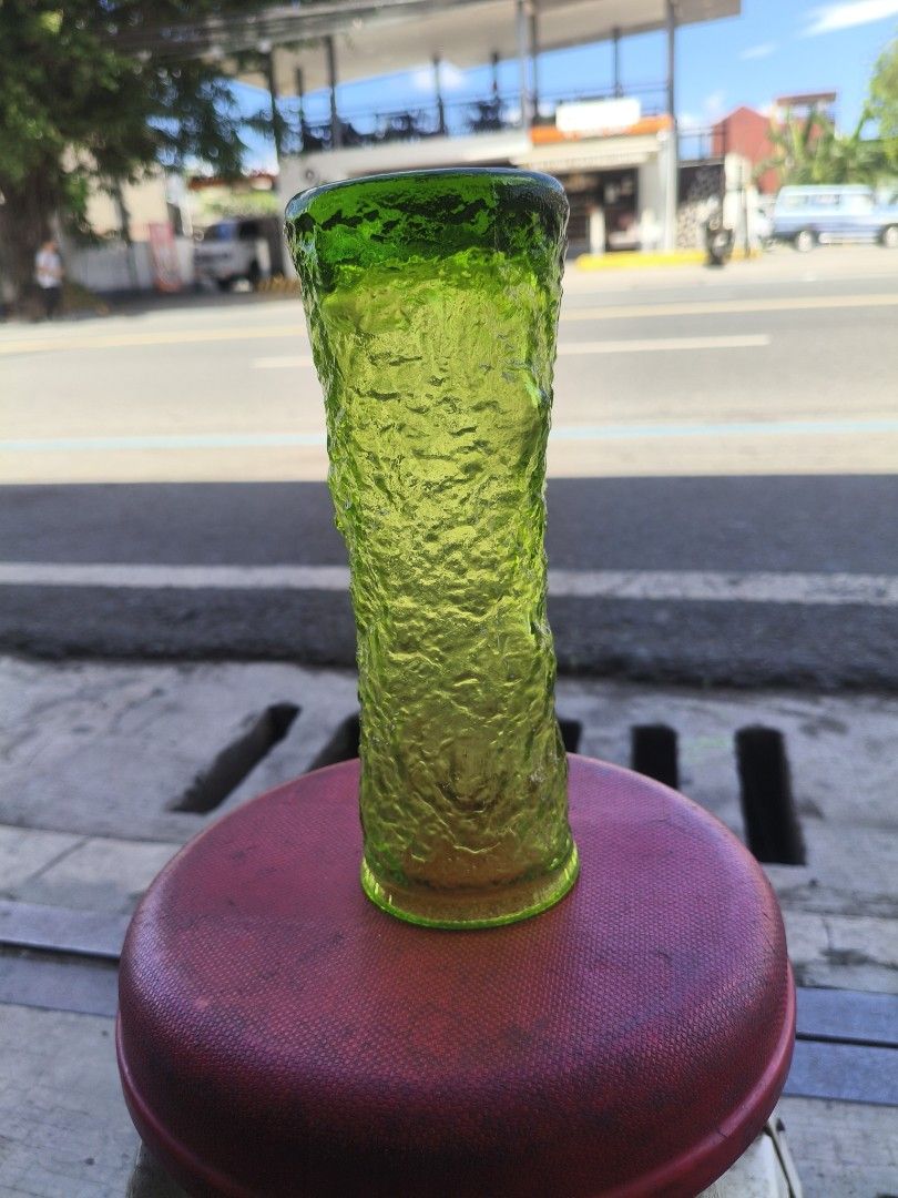 Green Textured Glass Vase (Category: Vases & Decorative Bowls) located in Manila. Submitted by tonio124 (Listing ID 1470771948, Image 3). Description: - Product: Green glass vase - Design: Straight cylindrical shape with a rough, bark-like texture - Stability: Features a solid base for secure placement on tables or shelves - Versatility: Ideal for floral arrangements or as a standalone decor piece.