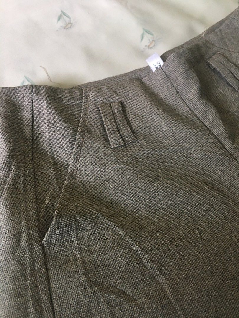 Grey high-waist shorts with pockets (Category: Shorts) located in Cabuyao City. Submitted by 4everblooms (Listing ID 1470800826, Image 2). Description: - Waistline: up to 29 - Fit: High-waist with a clean back and side zipper closure - Styling: Pairs effortlessly with blouses or basic tees for a chic smart-casual look.