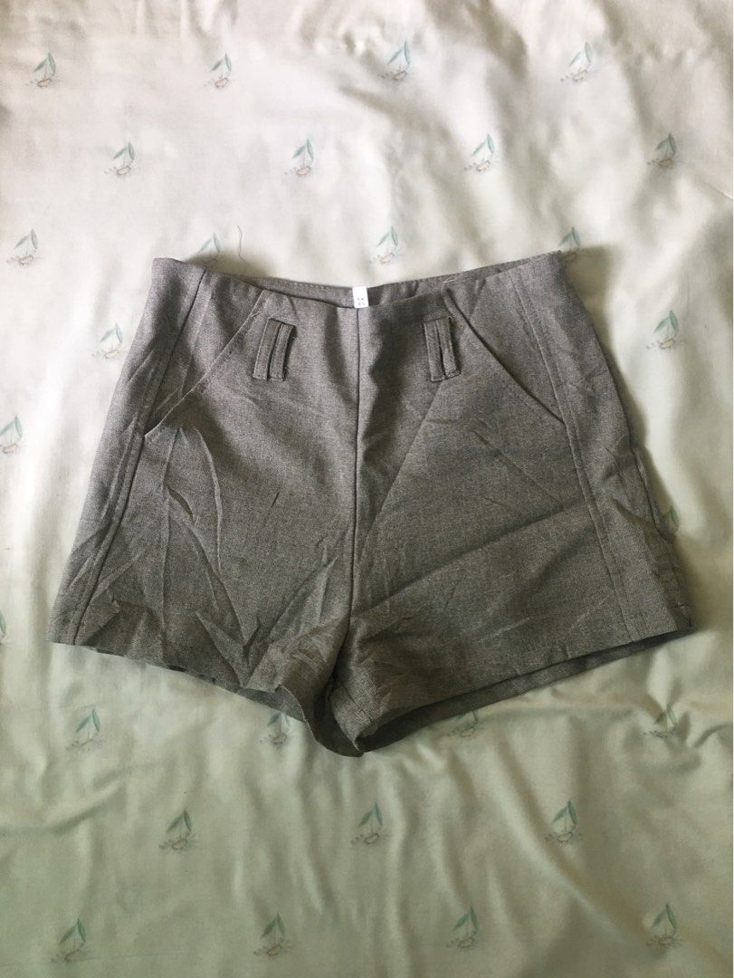 Grey high-waist shorts with pockets (Category: Shorts) located in Cabuyao City. Submitted by 4everblooms (Listing ID 1470800826, Image 1). Description: - Waistline: up to 29 - Fit: High-waist with a clean back and side zipper closure - Styling: Pairs effortlessly with blouses or basic tees for a chic smart-casual look.