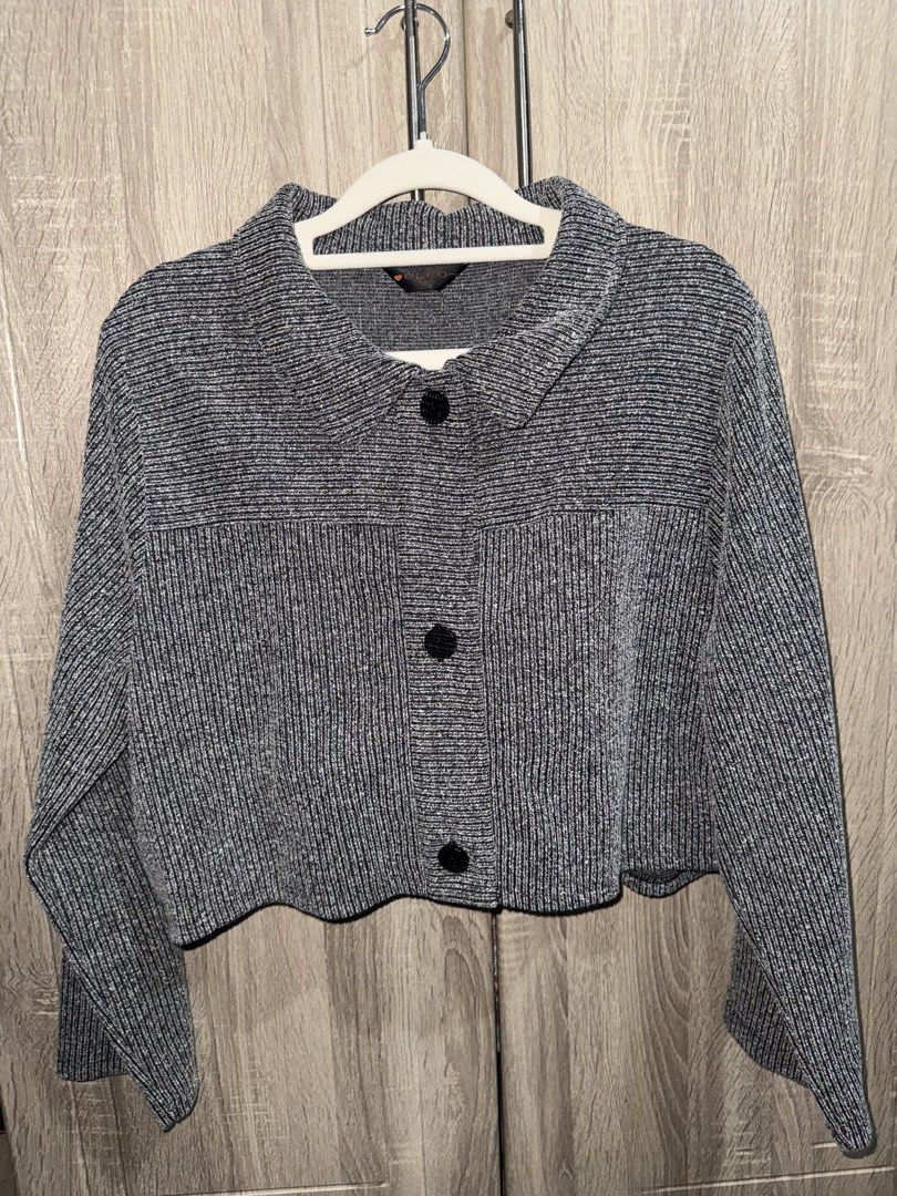 Grey knit two-piece crop top and jacket set (Category: Sets or Coordinates) located in Caloocan City. Submitted by femmiecruz (Listing ID 1470834841, Image 2). Description: - Brand: Cleo - Set includes: Long-sleeve cropped button-up jacket with collar and pockets + strapless crop top with ruffled detailing and front button accent - Color/Pattern: Grey and white textured knit - Material: Stretchy, comfortable fabric - Styling: Wear together as a m