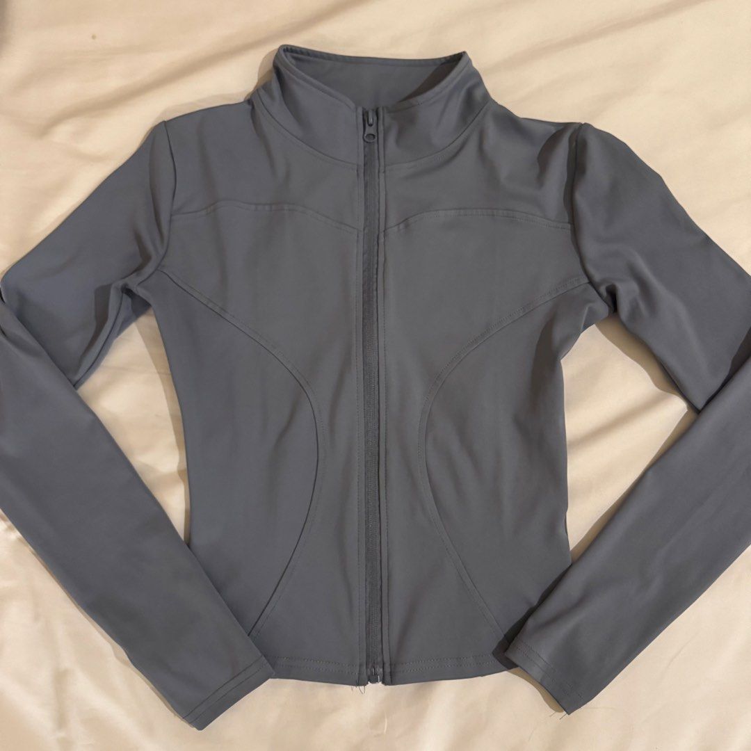 Grey Long-Sleeve Activewear Zip-Up Jacket (Category: Coats, Jackets and Outerwear) located in Quezon City. Submitted by s0l4nge (Listing ID 1470885671, Image 1). Description: - Style: Grey activewear zip-up jacket - Fit: Fitted cut with flattering contoured front seam lines - Design: High collar and full-length front zipper - Material: Smooth, comfortable athletic fabric - Condition: Excellent / Ready to wear.