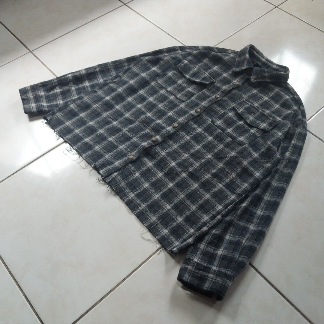 Grey Plaid Flannel Shirt Raw Hem (Category: Tshirts & Polo Shirts ) located in Cavite. Submitted by spinfits (Listing ID 1470770196, Image 2). Description: - Style: Grey and white plaid flannel with dark blue accents - Fit: Relaxed, oversized fit with a trendy raw/distressed hem - Features: Button-front closure and dual chest flap pockets - Details: Long sleeves with button cuffs - Fabric: Lightweight and comfortable cotton feel, perfect for dail