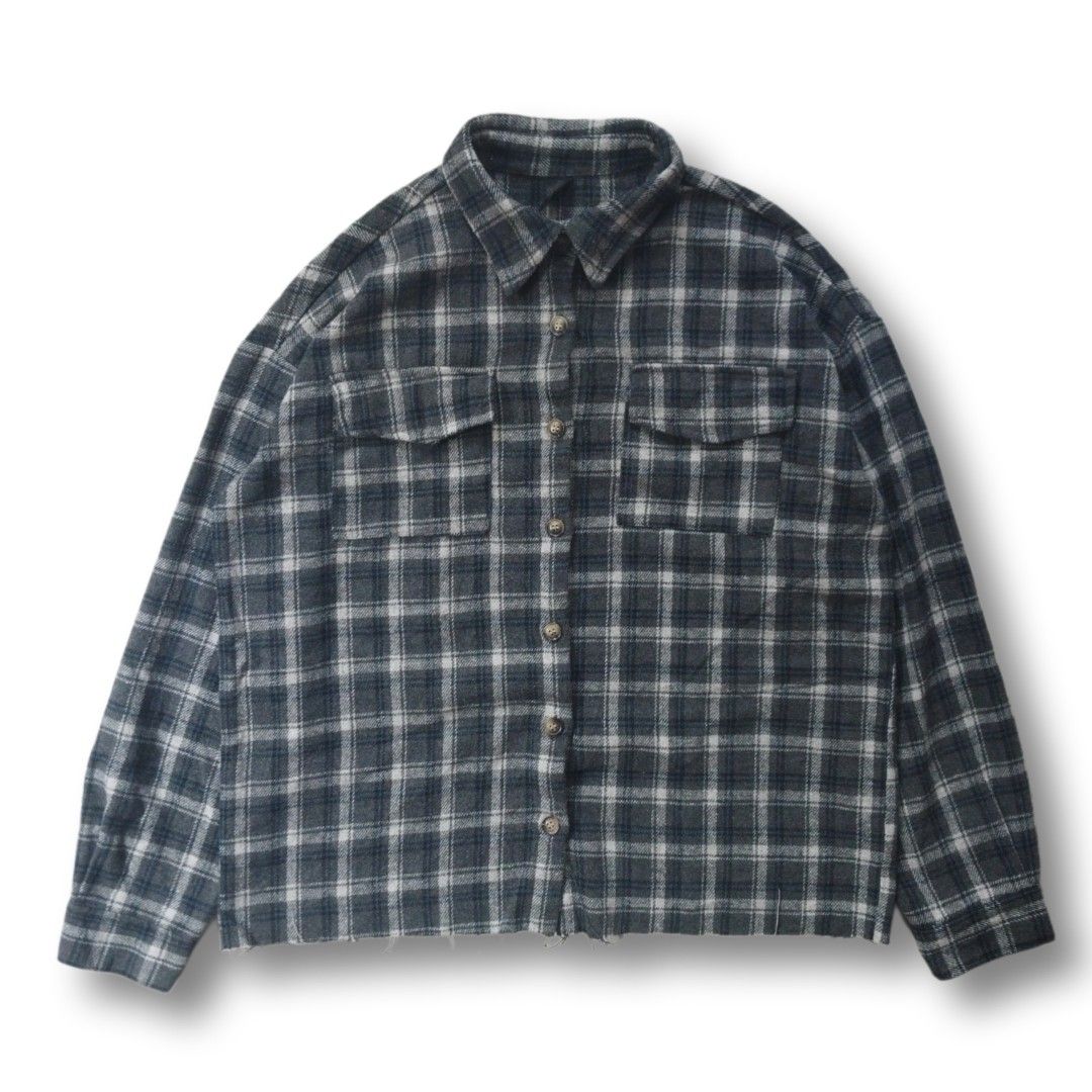 Grey Plaid Flannel Shirt Raw Hem (Category: Tshirts & Polo Shirts ) located in Cavite. Submitted by spinfits (Listing ID 1470770196, Image 1). Description: - Style: Grey and white plaid flannel with dark blue accents - Fit: Relaxed, oversized fit with a trendy raw/distressed hem - Features: Button-front closure and dual chest flap pockets - Details: Long sleeves with button cuffs - Fabric: Lightweight and comfortable cotton feel, perfect for dail