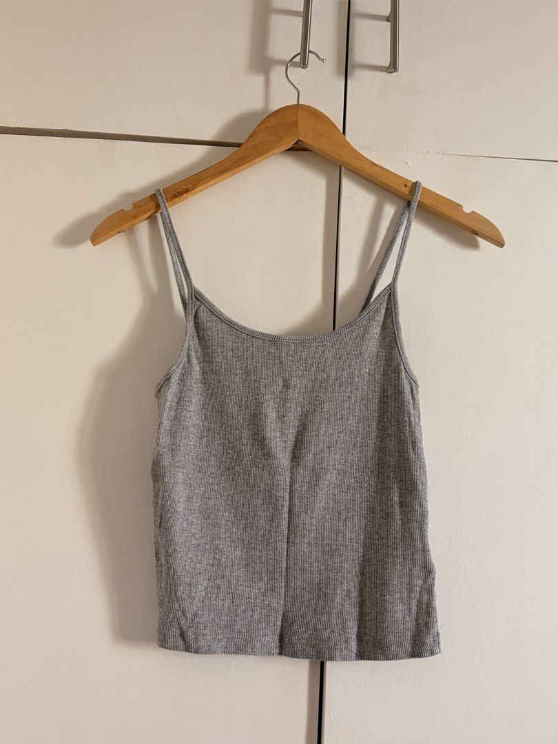 Grey Ribbed Spaghetti Strap Tank Top (Category: Sleeveless) located in Marikina City. Submitted by _bananahanaa (Listing ID 1470797293, Image 1). Description: - Color: Grey - Style: Ribbed crop top with scoop neckline - Straps: Trendy double spaghetti straps - Fit: Fitted cut with great stretch - Condition: Excellent, clean with no stains or damage - Perfect basic piece for layering or hot weather wear - fits small-medium.