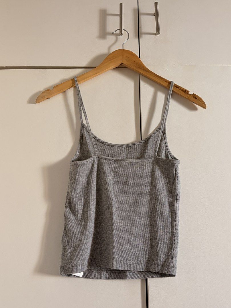 Grey Ribbed Spaghetti Strap Tank Top (Category: Sleeveless) located in Marikina City. Submitted by _bananahanaa (Listing ID 1470797293, Image 2). Description: - Color: Grey - Style: Ribbed crop top with scoop neckline - Straps: Trendy double spaghetti straps - Fit: Fitted cut with great stretch - Condition: Excellent, clean with no stains or damage - Perfect basic piece for layering or hot weather wear - fits small-medium.