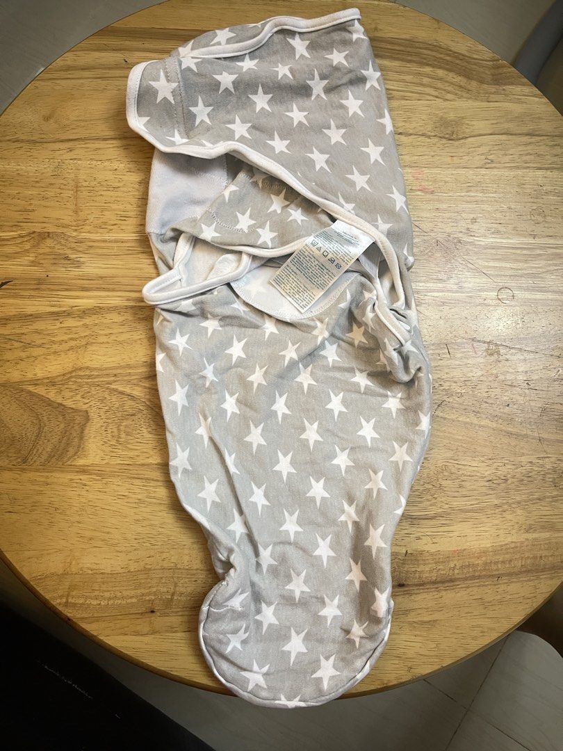 Grey Star Baby Swaddle Wrap (Category: Babies & Kids Fashion) located in Quezon City. Submitted by thefourcees (Listing ID 1470841596, Image 1). Description: - Cute grey and white star pattern - Super soft 100% cotton material - Secure Velcro flaps inside to keep newborns snug and cozy - Easy to use for quick and hassle-free swaddling - Clean and ready for immediate use - Wash tag attached.