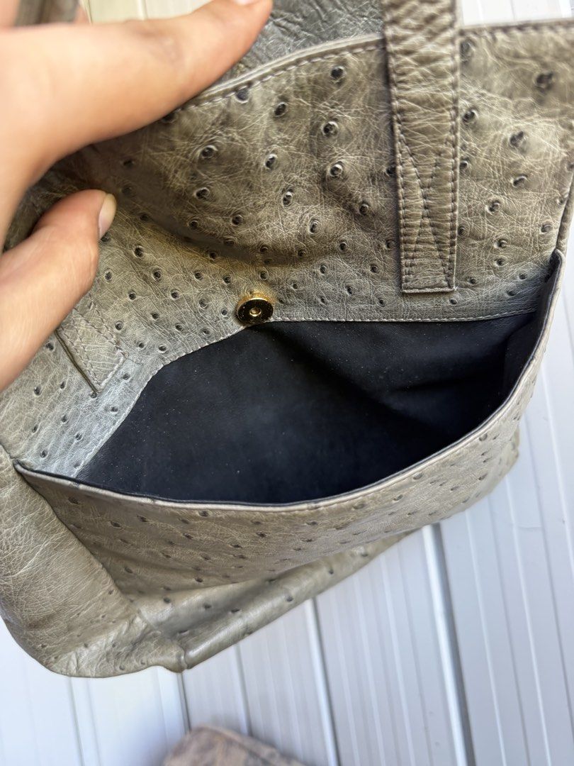 Grey textured leather tote handbag with double handles (Category: Tote Bags) located in Digos. Submitted by old_soul. (Listing ID 1470802264, Image 3). Description: - Style: Grey textured leather tote - Handles: Double top handles for easy carrying - Closure: Open top with secure magnetic snap - Interior: Black lining with multiple zippered compartments and slip pockets - Condition: Clean structure with plenty of room for daily essentials - RUSH 