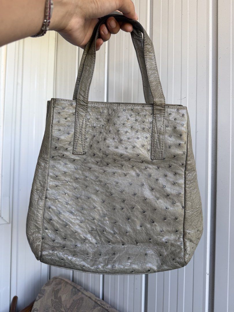 Grey textured leather tote handbag with double handles (Category: Tote Bags) located in Digos. Submitted by old_soul. (Listing ID 1470802264, Image 1). Description: - Style: Grey textured leather tote - Handles: Double top handles for easy carrying - Closure: Open top with secure magnetic snap - Interior: Black lining with multiple zippered compartments and slip pockets - Condition: Clean structure with plenty of room for daily essentials - RUSH 